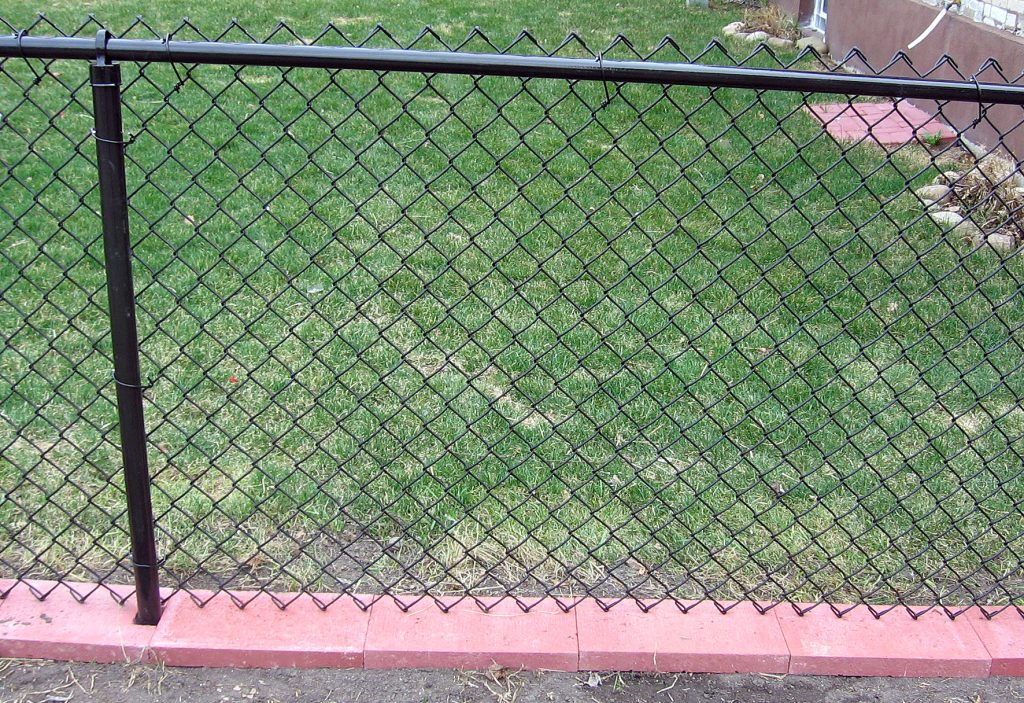black vinyl chain link fence red brick base